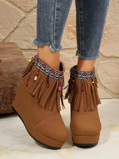 Fringe Suede Wedge BootsElevate your style with these Fringe Suede Wedge Boots! Crafted with high-quality elastomer and suede, these boots provide comfort and durability. With a heel heightShoesPlush Fashion ShopPlush Fashion ShopFringe Suede Wedge Boots