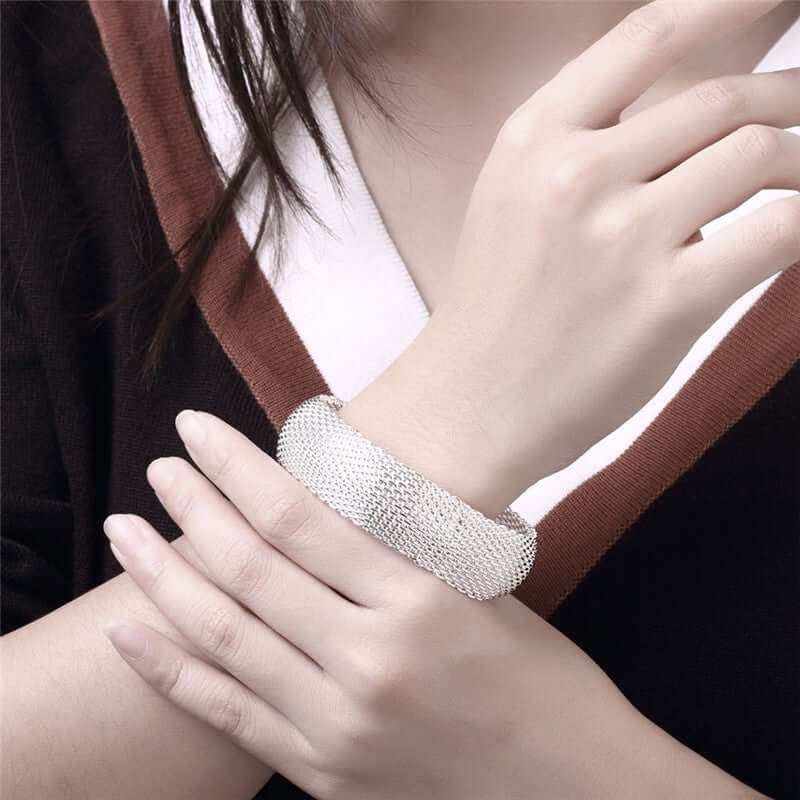 Women's silver mesh braceletIndulge in elegance with our Women's Silver Mesh Bracelet. Crafted with environmentally friendly copper and plated with 925 silver, this dazzling bracelet features aBraceletPlush Fashions ShopPlush Fashion Shopsilver mesh bracelet