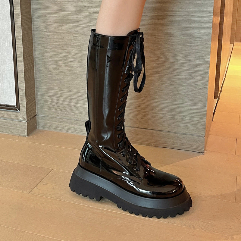 Thick-soled black high boots with round toe and side zipper for women.