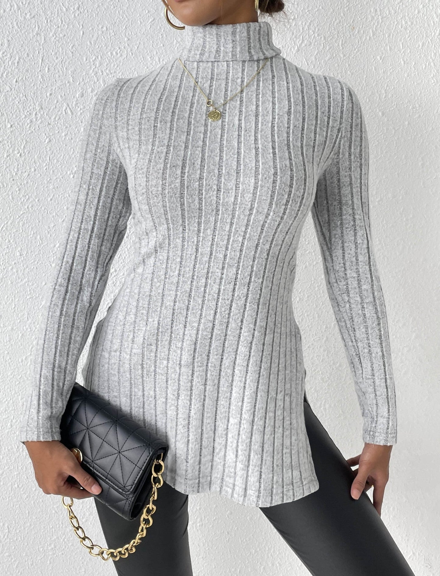 Women's gray velvet turtleneck pullover sweater, elegant winter fashion.