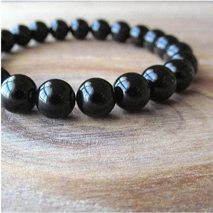 Black Onyx BraceletExperience the power of the Black Onyx Bracelet. Made with an imported elastic cord and featuring 8MM geometric black agate beads, this bracelet is not just stylish BraceletPlush Fashions ShopPlush Fashion ShopBlack Onyx Bracelet