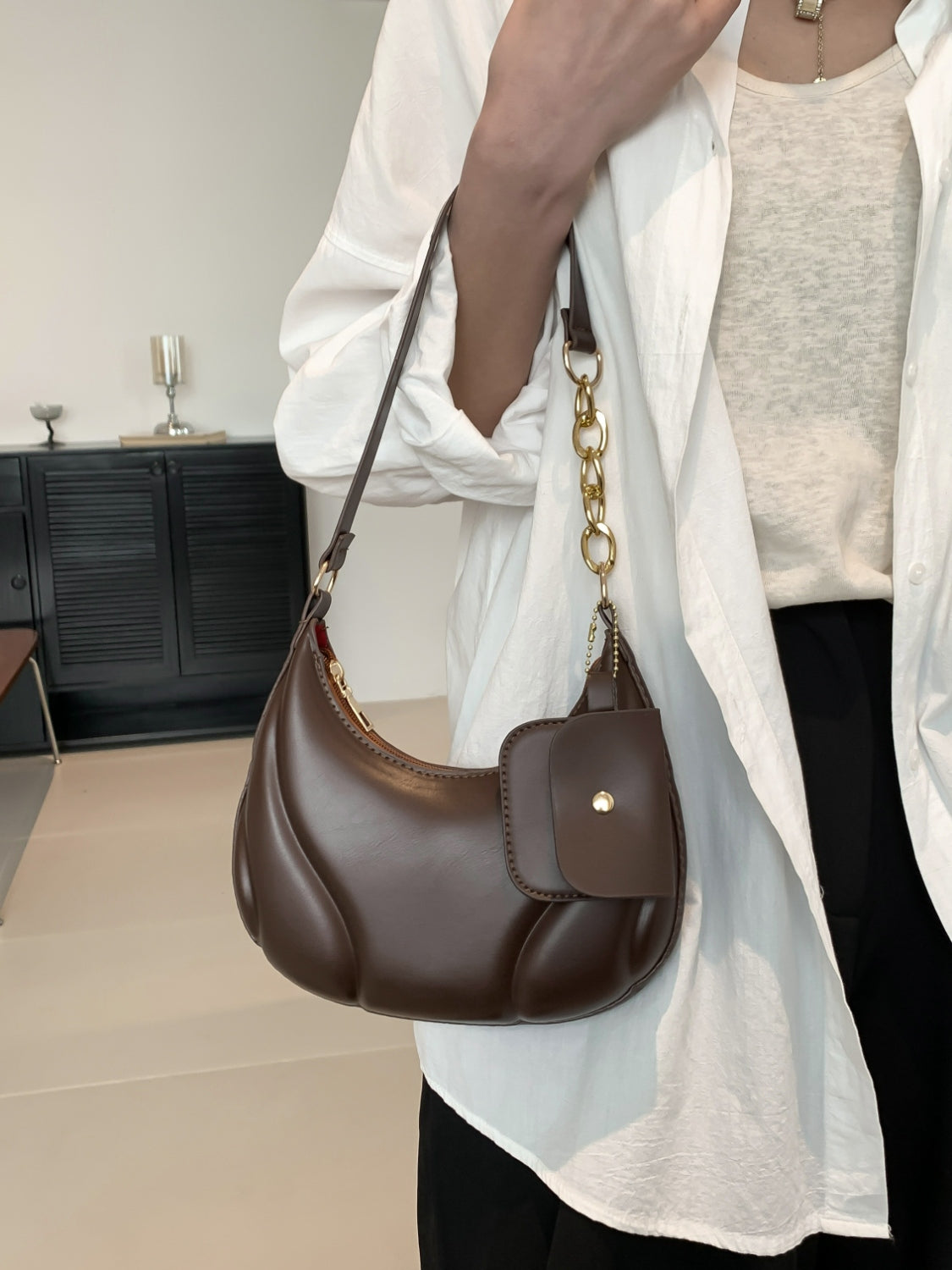 PU Leather Shoulder Bag with EarPods BagCarry your essentials in style with our PU Leather Shoulder Bag! Made from imported PU leather, this medium-sized bag is perfect for day-to-day use. The spacious intHand bagPlush Fashion ShopPlush Fashion ShopPU Leather Shoulder Bag