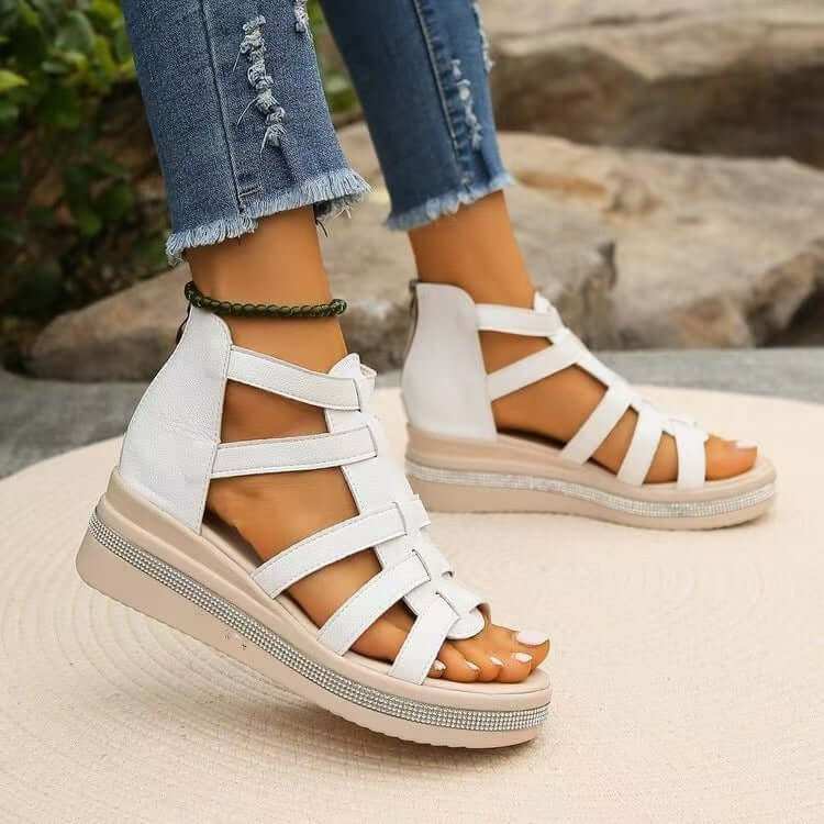 Cutout Rhinestone Trim Wedge SandalsElevate your style with our Cutout Rhinestone Trim Wedge Sandals! These comfortable flats feature a wedge heel that adds height without sacrificing comfort. Made witShoesPlush Fashion ShopPlush Fashion ShopCutout Rhinestone Trim Wedge Sandals