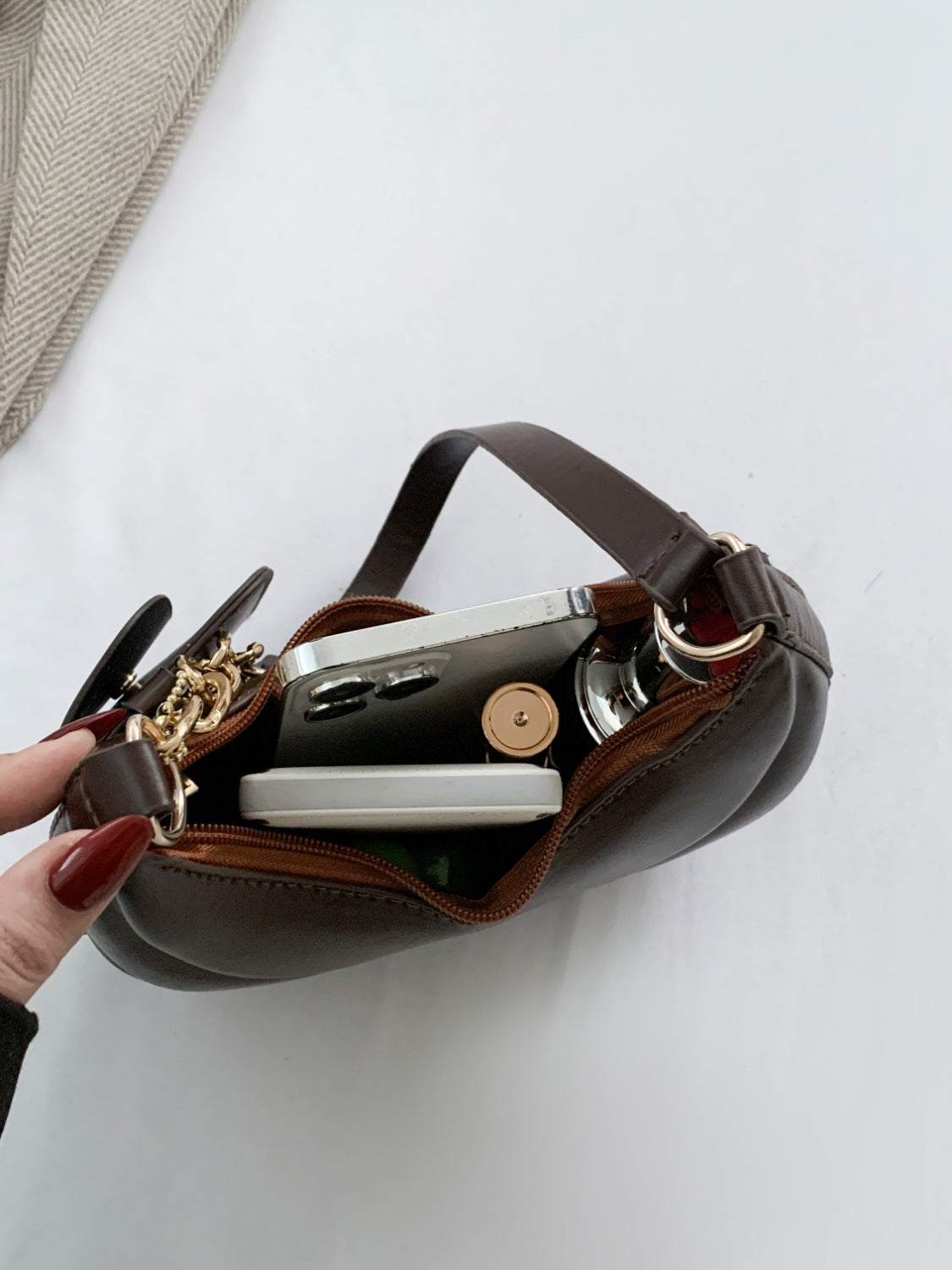 PU Leather Shoulder Bag with EarPods BagCarry your essentials in style with our PU Leather Shoulder Bag! Made from imported PU leather, this medium-sized bag is perfect for day-to-day use. The spacious intHand bagPlush Fashion ShopPlush Fashion ShopPU Leather Shoulder Bag