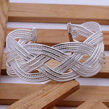 Silver Bangle BraceletAdd a touch of elegance to your outfit with our Silver Bangle Bracelet! Made from high-quality copper, this bracelet comes in two sizes and is sure to make a statemeBraceletPlush Fashions ShopPlush Fashion ShopSilver Bangle Bracelet