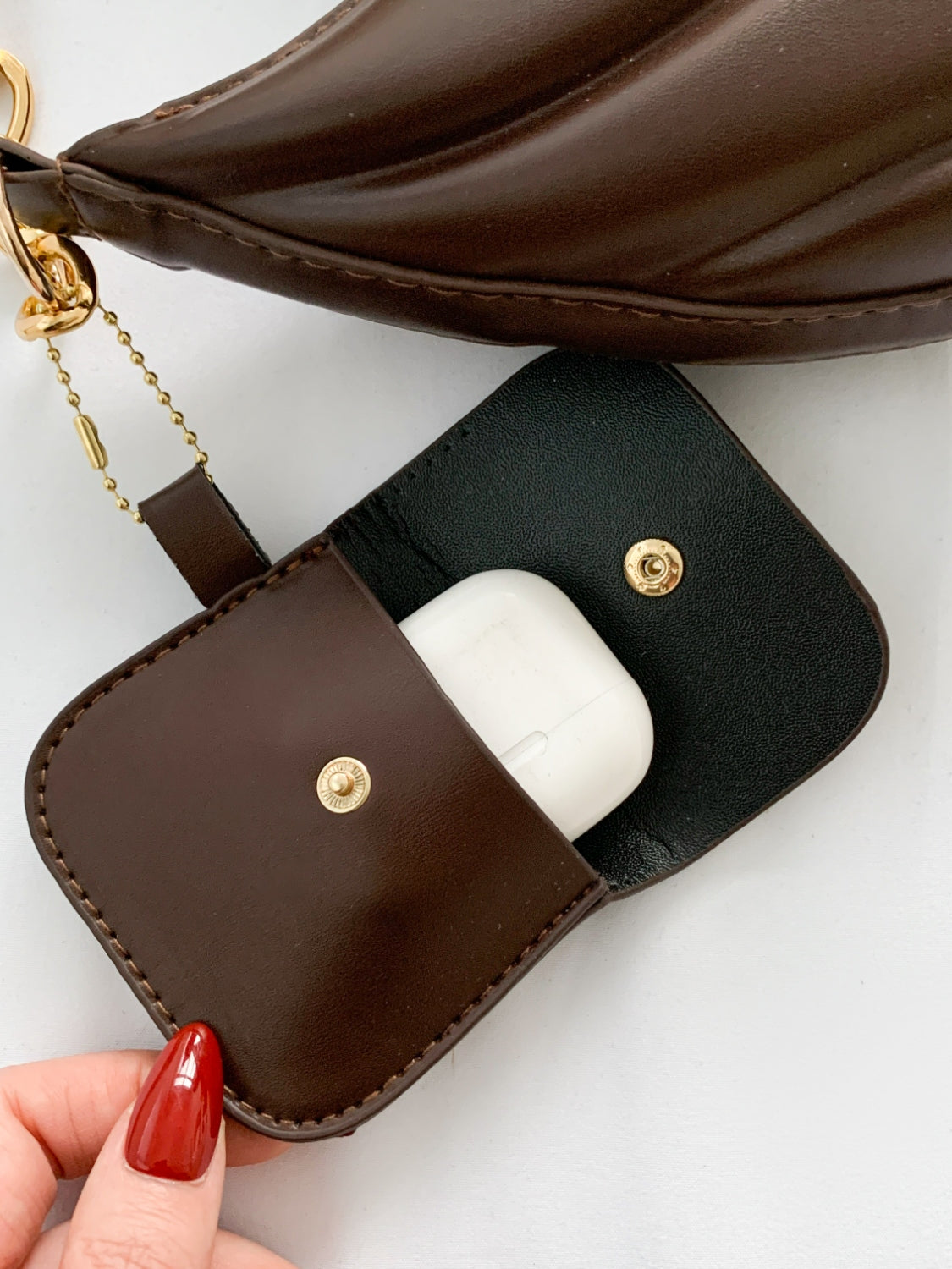 PU Leather Shoulder Bag with EarPods BagCarry your essentials in style with our PU Leather Shoulder Bag! Made from imported PU leather, this medium-sized bag is perfect for day-to-day use. The spacious intHand bagPlush Fashion ShopPlush Fashion ShopPU Leather Shoulder Bag