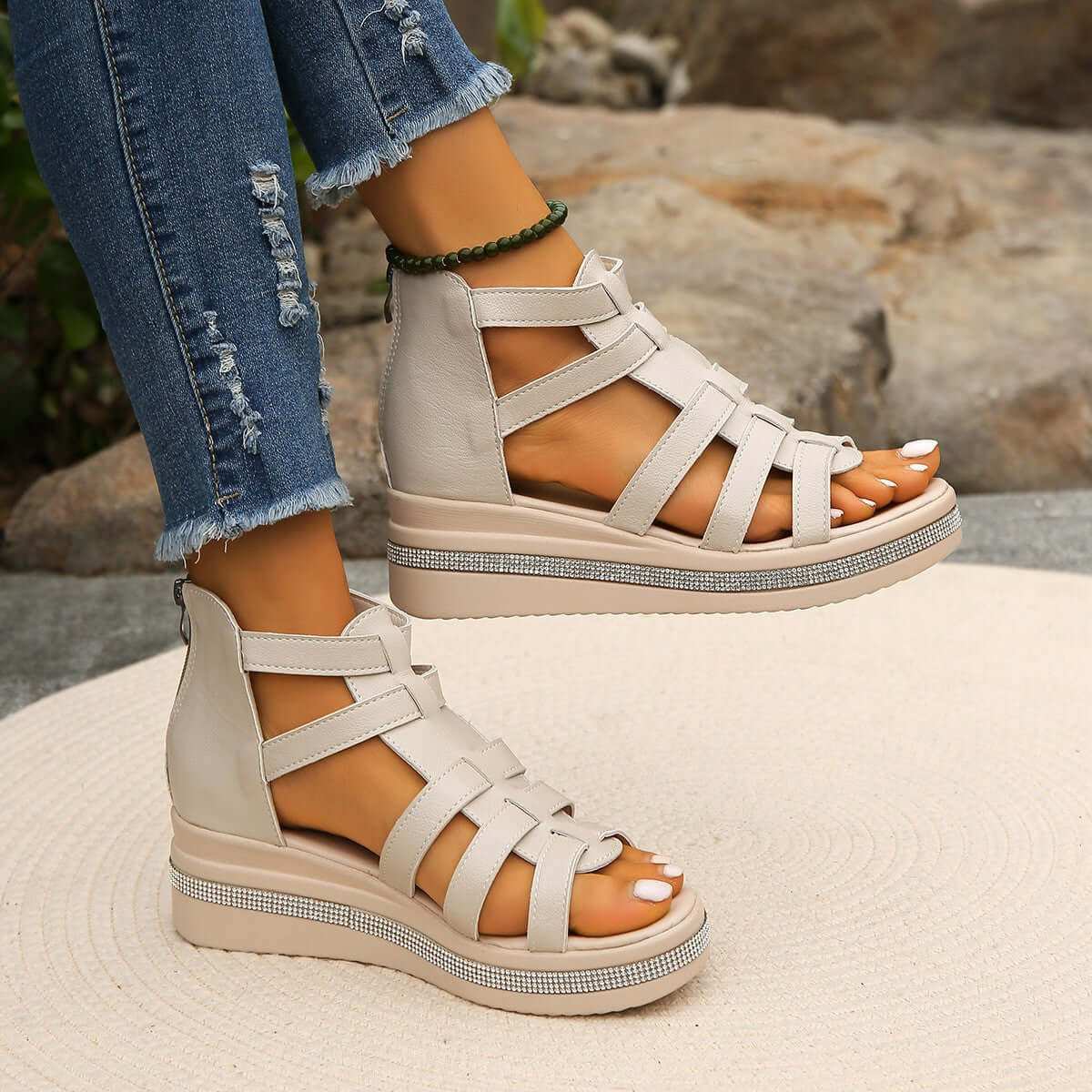 Cutout Rhinestone Trim Wedge SandalsElevate your style with our Cutout Rhinestone Trim Wedge Sandals! These comfortable flats feature a wedge heel that adds height without sacrificing comfort. Made witShoesPlush Fashion ShopPlush Fashion ShopCutout Rhinestone Trim Wedge Sandals