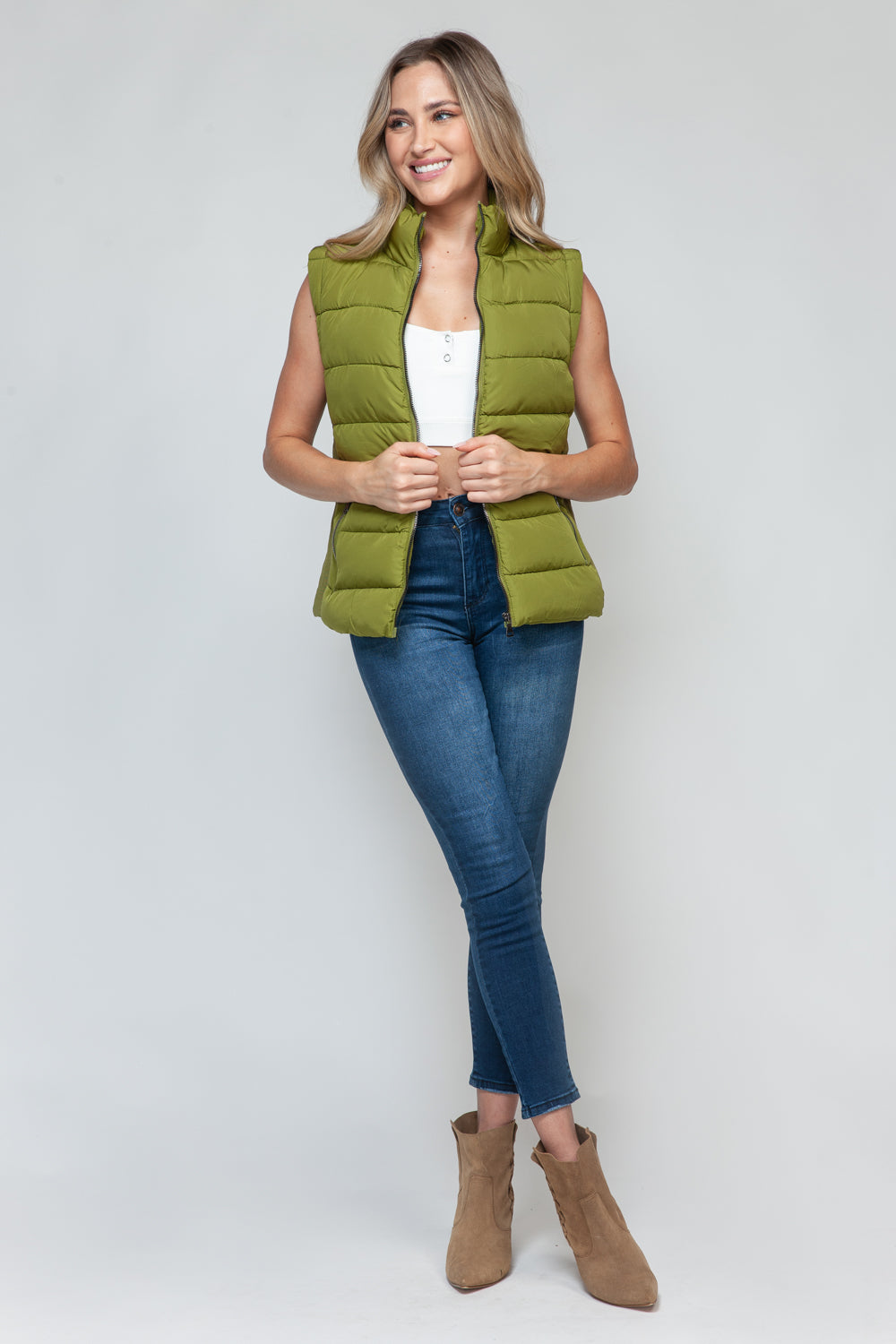 Snobbish Zip Up Turtleneck Vest with PocketsComplete your wardrobe with our Snobbish Zip Up Turtleneck Vest! With a stylish zip-up front and cozy turtleneck, this vest offers both fashion and warmth. The additCoatsPlush Fashion ShopPlush Fashion ShopSnobbish Zip