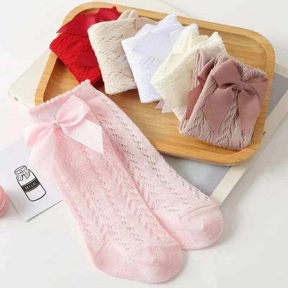 Baby Girls Long Bow SockWrap your little one's feet in soft cotton with our Baby Girls Long Bow Sock. These knee-highs feature a Spanish-inspired design with delicate lace detailing, perfecSocksPlush Fashions ShopPlush Fashion ShopBaby Girls Long Bow Sock