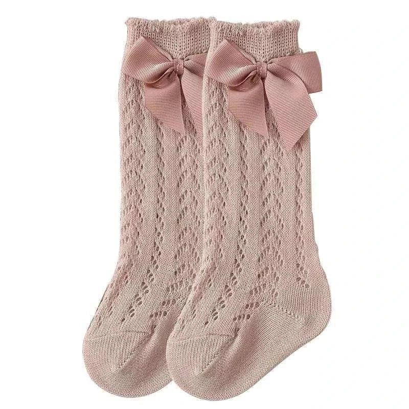 Baby Girls Long Bow SockWrap your little one's feet in soft cotton with our Baby Girls Long Bow Sock. These knee-highs feature a Spanish-inspired design with delicate lace detailing, perfecSocksPlush Fashions ShopPlush Fashion ShopBaby Girls Long Bow Sock