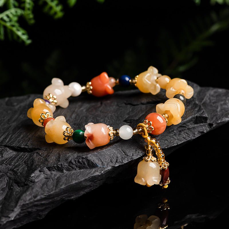 Natural Xinjiang Gold Silk Magnolia BraceletIntroducing our Natural Xinjiang Gold Silk Magnolia Bracelet, made with authentic Jinsi Jade from the Xinjiang province. This exquisite ethnic style bracelet featureBracletPlush Fashions ShopPlush Fashion ShopNatural Xinjiang Gold Silk Magnolia Bracelet