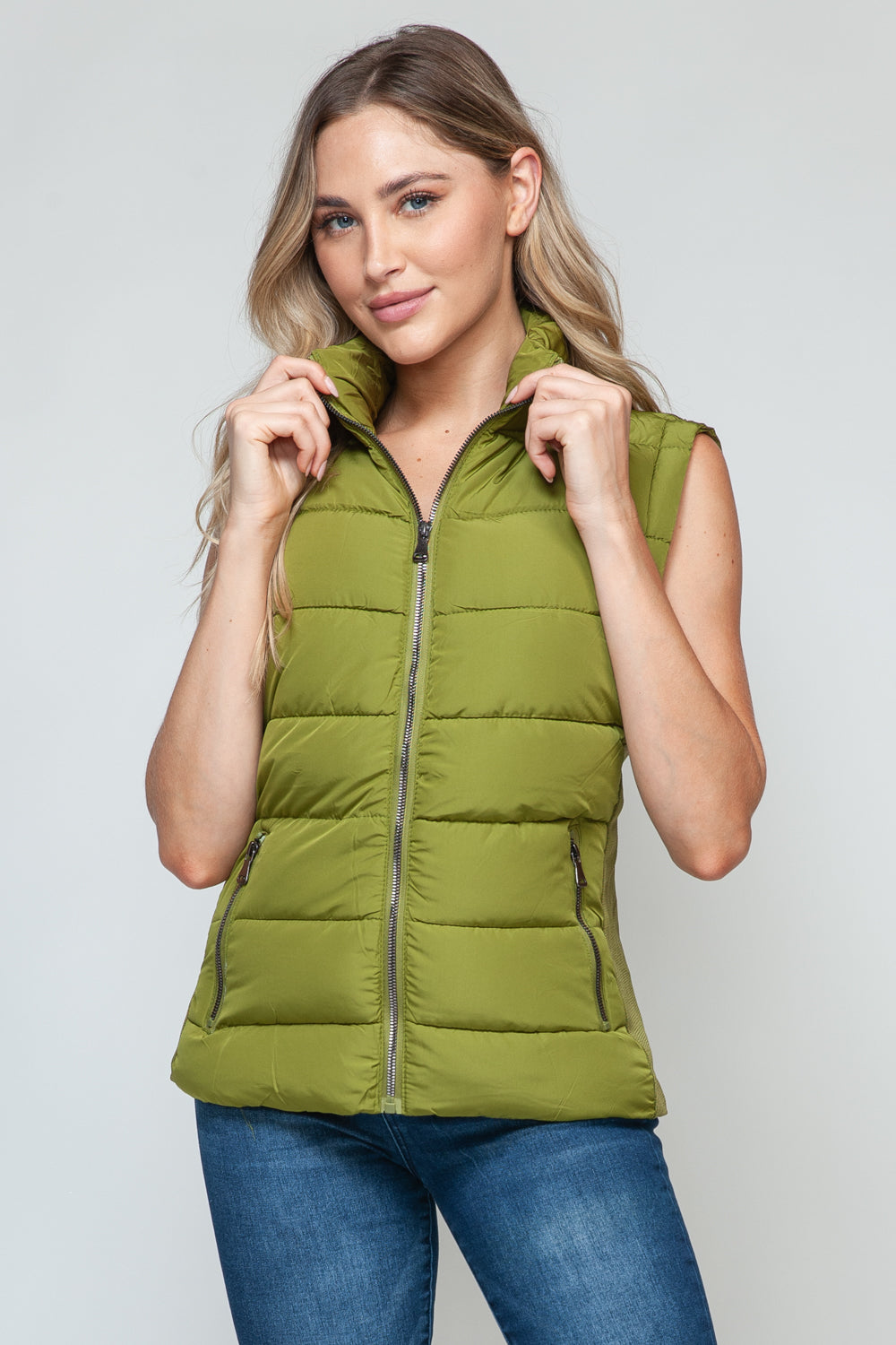 Snobbish Zip Up Turtleneck Vest with PocketsComplete your wardrobe with our Snobbish Zip Up Turtleneck Vest! With a stylish zip-up front and cozy turtleneck, this vest offers both fashion and warmth. The additCoatsPlush Fashion ShopPlush Fashion ShopSnobbish Zip