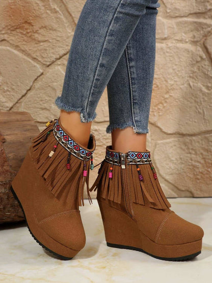 Fringe Suede Wedge BootsElevate your style with these Fringe Suede Wedge Boots! Crafted with high-quality elastomer and suede, these boots provide comfort and durability. With a heel heightShoesPlush Fashion ShopPlush Fashion ShopFringe Suede Wedge Boots