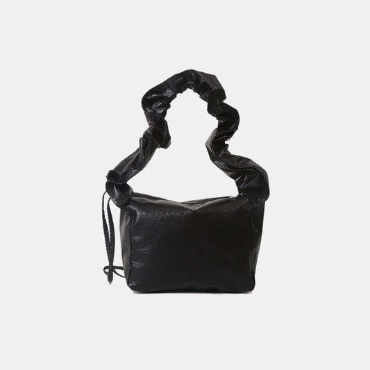 PU leather drawstring shoulder bag in black with ruched strap.