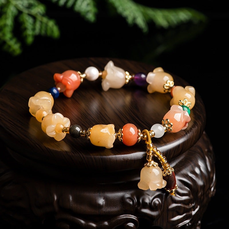 Natural Xinjiang Gold Silk Magnolia BraceletIntroducing our Natural Xinjiang Gold Silk Magnolia Bracelet, made with authentic Jinsi Jade from the Xinjiang province. This exquisite ethnic style bracelet featureBracletPlush Fashions ShopPlush Fashion ShopNatural Xinjiang Gold Silk Magnolia Bracelet