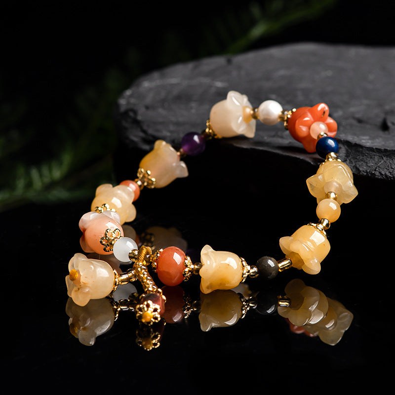 Natural Xinjiang Gold Silk Magnolia BraceletIntroducing our Natural Xinjiang Gold Silk Magnolia Bracelet, made with authentic Jinsi Jade from the Xinjiang province. This exquisite ethnic style bracelet featureBracletPlush Fashions ShopPlush Fashion ShopNatural Xinjiang Gold Silk Magnolia Bracelet