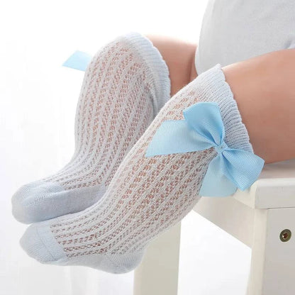 Baby Girls Long Bow SockWrap your little one's feet in soft cotton with our Baby Girls Long Bow Sock. These knee-highs feature a Spanish-inspired design with delicate lace detailing, perfecSocksPlush Fashions ShopPlush Fashion ShopBaby Girls Long Bow Sock