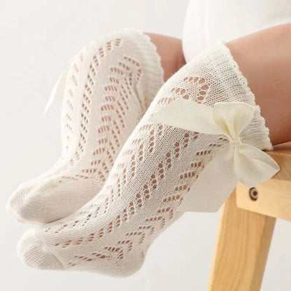 Baby Girls Long Bow SockWrap your little one's feet in soft cotton with our Baby Girls Long Bow Sock. These knee-highs feature a Spanish-inspired design with delicate lace detailing, perfecSocksPlush Fashions ShopPlush Fashion ShopBaby Girls Long Bow Sock