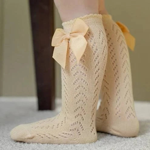 Baby Girls Long Bow SockWrap your little one's feet in soft cotton with our Baby Girls Long Bow Sock. These knee-highs feature a Spanish-inspired design with delicate lace detailing, perfecSocksPlush Fashions ShopPlush Fashion ShopBaby Girls Long Bow Sock