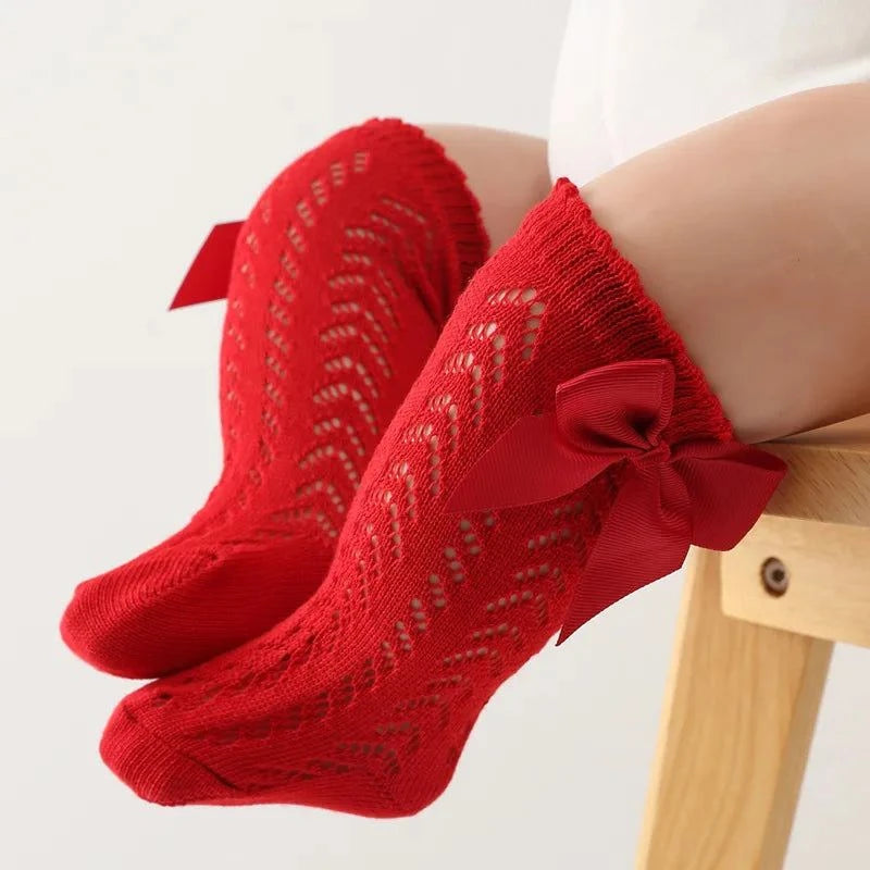 Baby Girls Long Bow SockWrap your little one's feet in soft cotton with our Baby Girls Long Bow Sock. These knee-highs feature a Spanish-inspired design with delicate lace detailing, perfecSocksPlush Fashions ShopPlush Fashion ShopBaby Girls Long Bow Sock